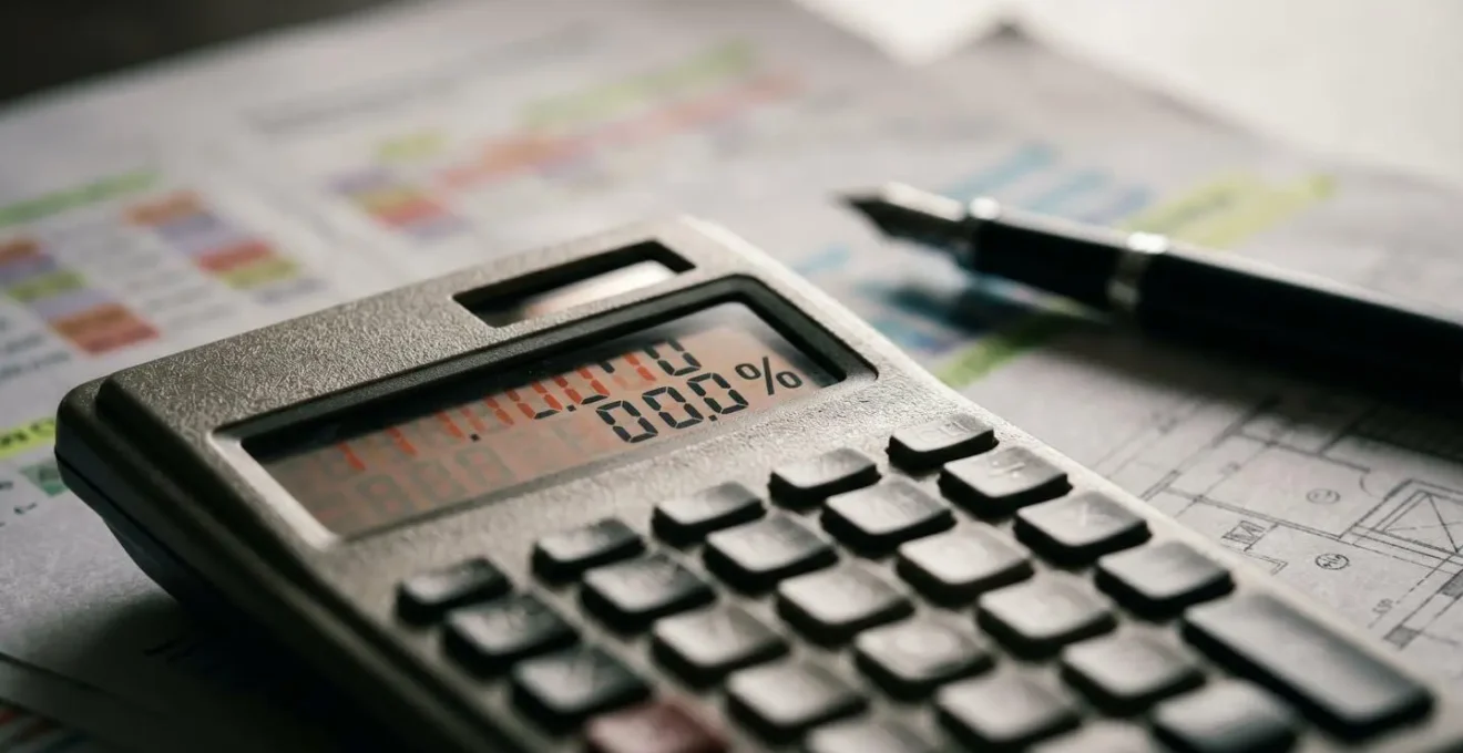 Financial calculator and rental income documents showing interest coverage ratio improvements through remortgage strategy