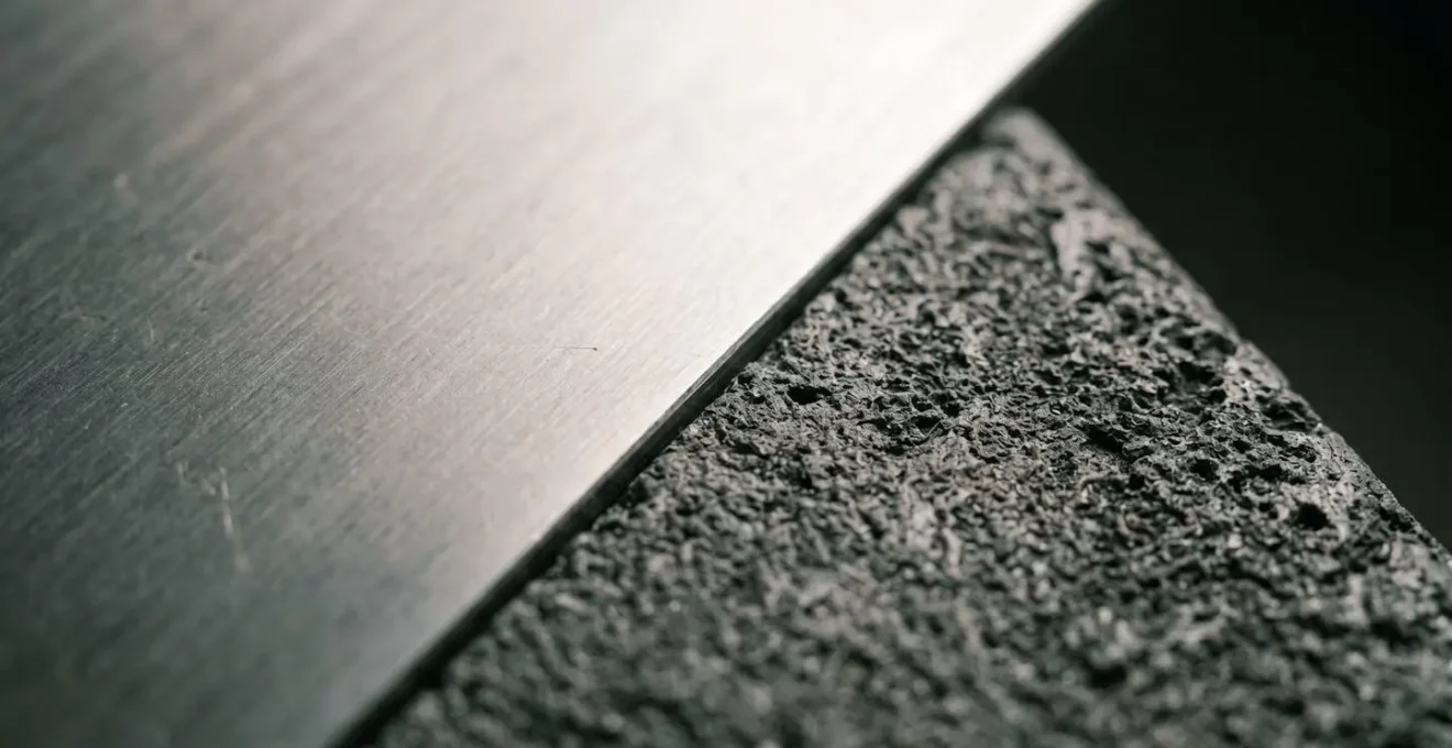 Abstract close-up photograph showing a sharp edge or boundary between two contrasting surfaces representing the LTV threshold cliff-edge effect